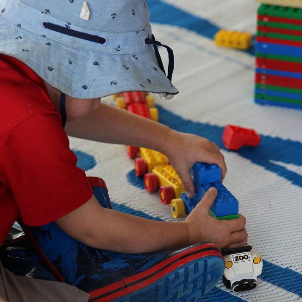 Preschooler playing with toy train