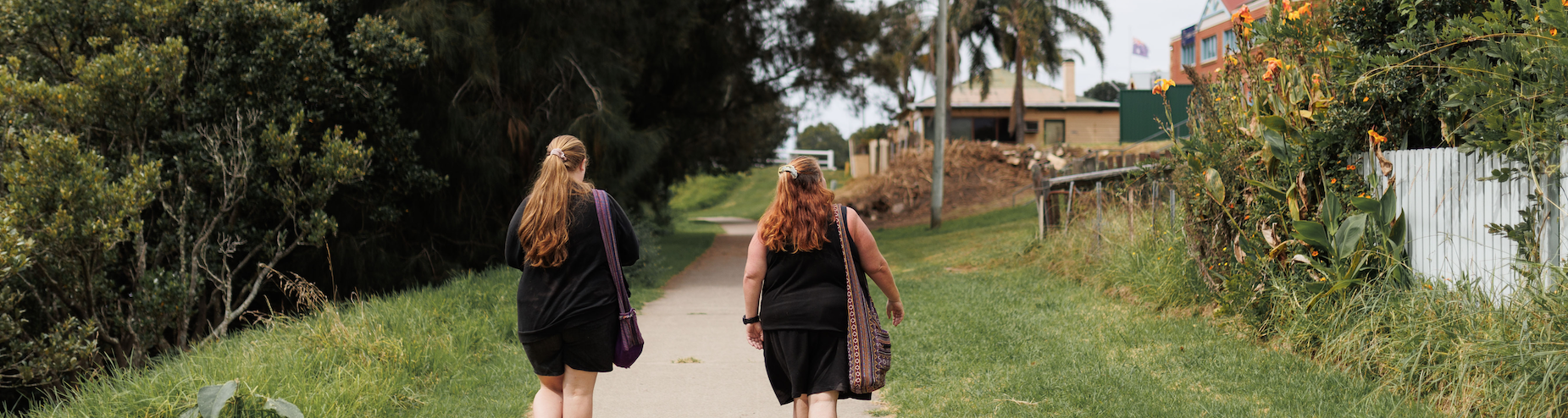 Mother and daughter walking away