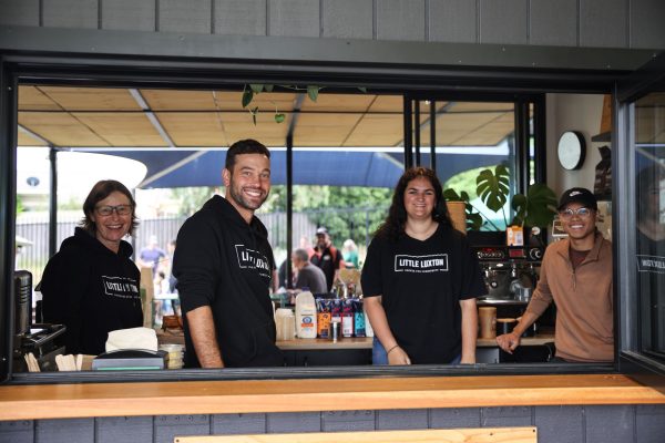Staff from social enterprise cafe Little Luxton face the camera with smiles