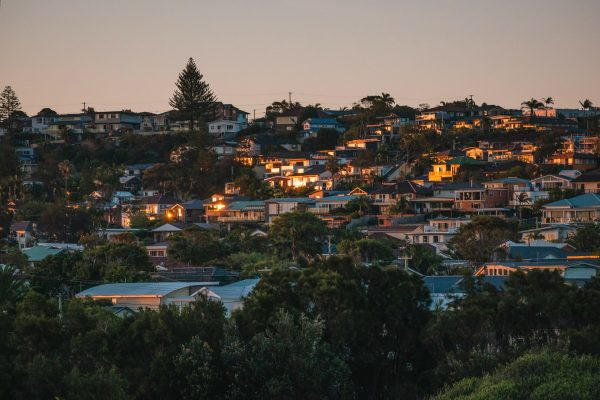 houses grouped together on a hill at evening