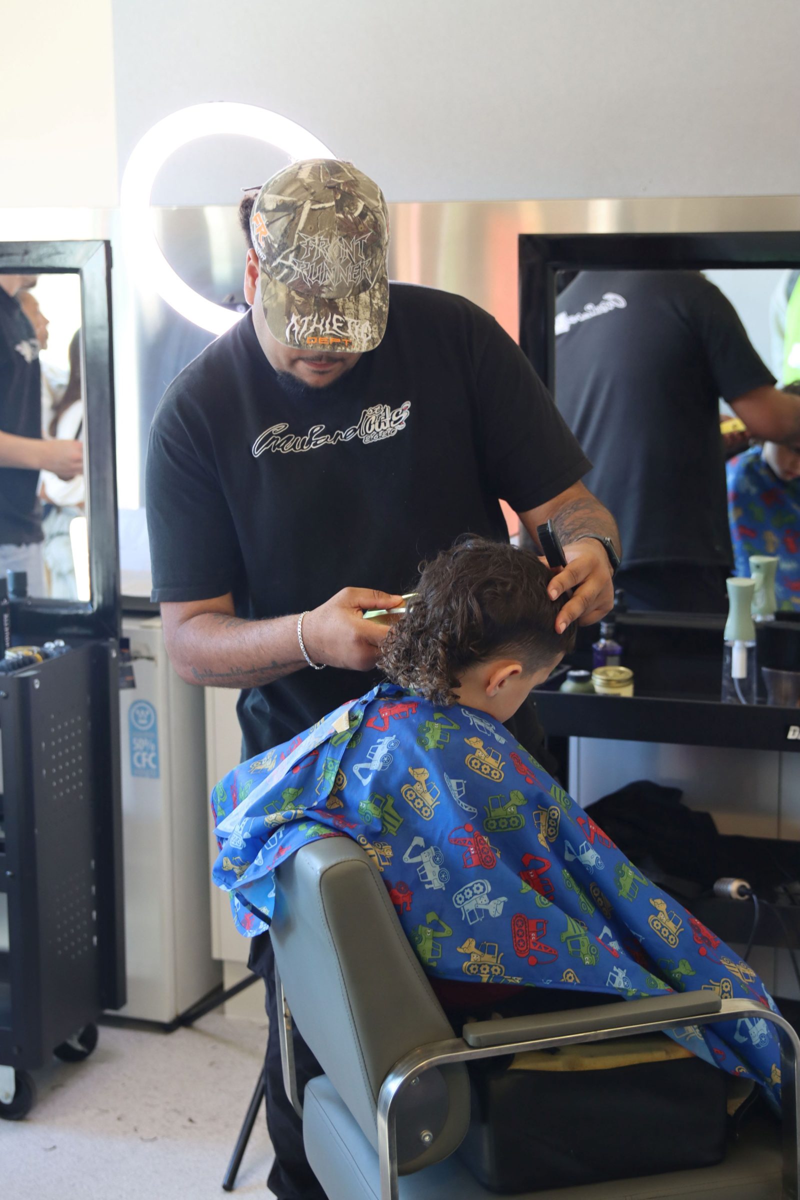 Boy getting his hair cut at the Canberra NAIDOC event 2026