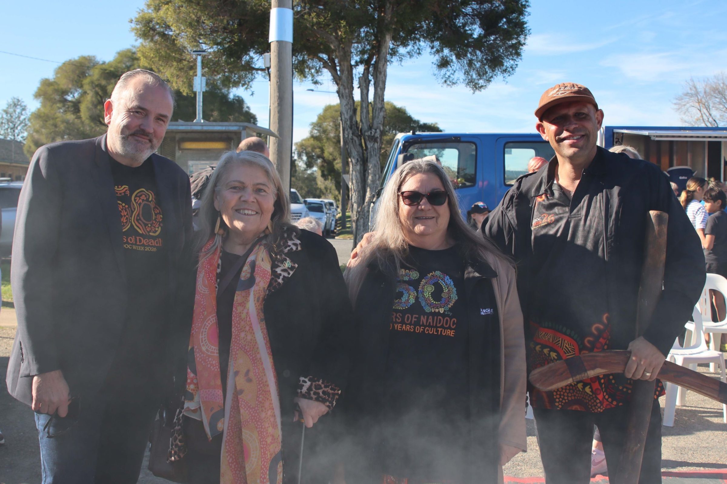 Anglicare CEO Trevor Ament, Auntie Mary Atkinson, Anglicare staff member Judy Steelman and didgeridoo player at NAIDOC event in Ashmont