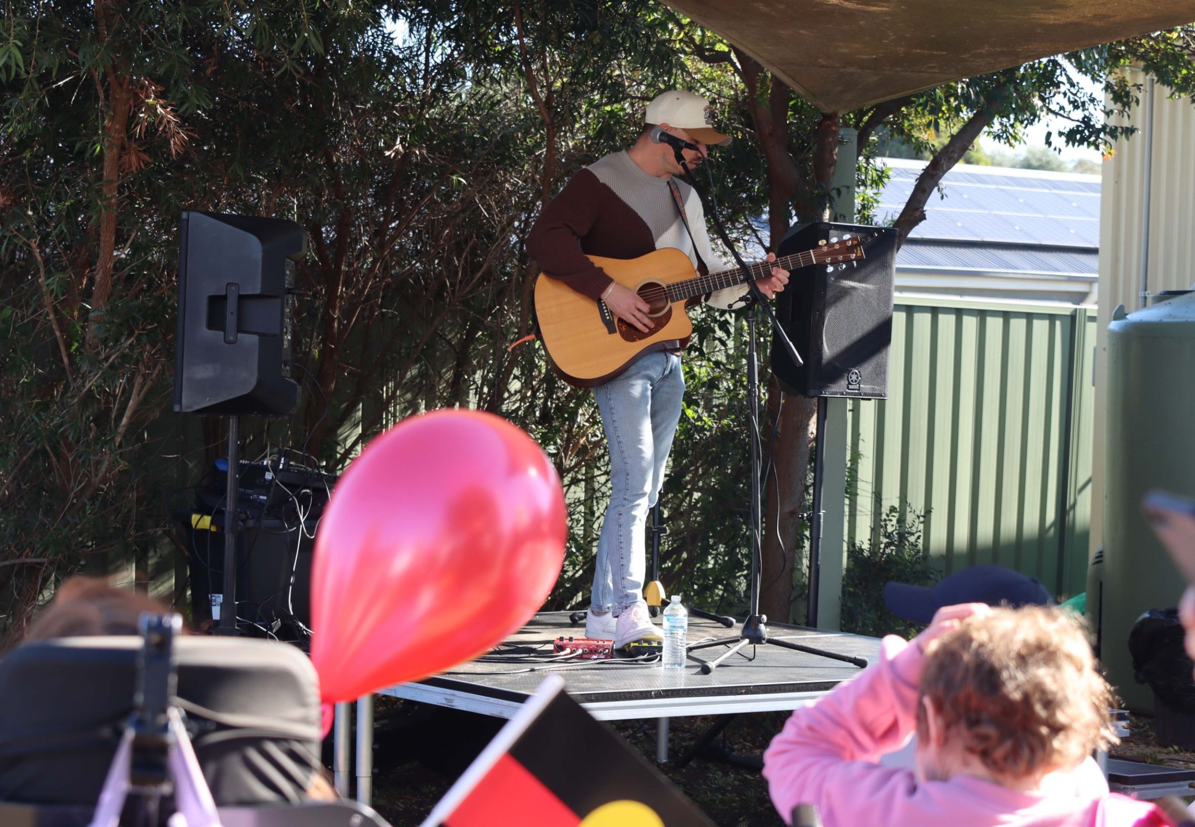Renowned singer songwriter, Nathan Lamont performing at Ashmont NAIDOC event