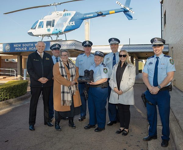 Anglicare Director of Housing Services, Toni Reay and staff from the NSW Police Academy with a donation of gently used boots